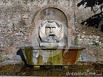 Santa Sabina, mask fountain in Rome , Italy Stock Photo