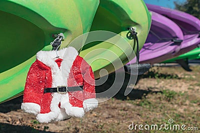 Santa suit hangs off kayaks in Lake Louisa State Park near Orlando, Florida Stock Photo