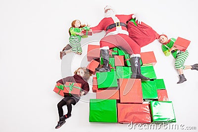 Santa's helpers working at North Pole. He reading wishes list Stock Photo