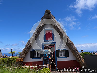 Santana in Madeira is a beautiful village on the north coast. is known by its small thatched triangular houses. Dragon Trees and f Editorial Stock Photo