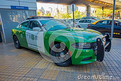 SANTIAGO, CHILE - OCTOBER 16, 2018: Outdoor view of green Police carabineros car parked in the city streets Editorial Stock Photo