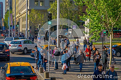 SANTIAGO, CHILE - SEPTEMBER 13, 2018: Outdoor view of Traffic flow on streets of Santiago with crowd of people walking Editorial Stock Photo