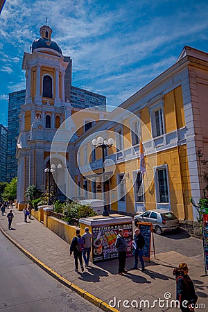SANTIAGO, CHILE - SEPTEMBER 13, 2018: Outdoor view of unidentified people walking in the sidewalk in front of huge Editorial Stock Photo