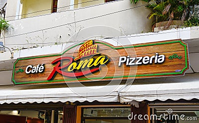 Santo Domingo, Dominican Republic. Wood sign of cafÃ¨ pizzeria Roma situated in El Conde street. Editorial Stock Photo