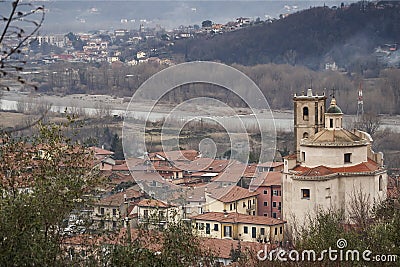 Santo Stefano Magra in Lunigiana area of Italy in La Spezia province. Church, houses and River Magra. Wintry day. Stock Photo