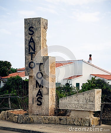 Santo Thomas holiday city entrance limestone sign monument in Menorca, Spain, September 12, 2019 Editorial Stock Photo