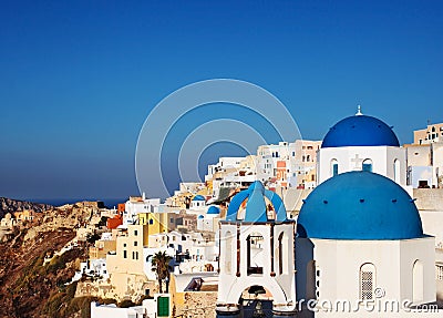 Santorini blue dome churches in Oia Village, Greece. Stock Photo