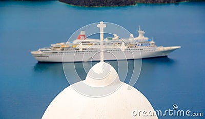 Santorini church cross and cruise ship Stock Photo