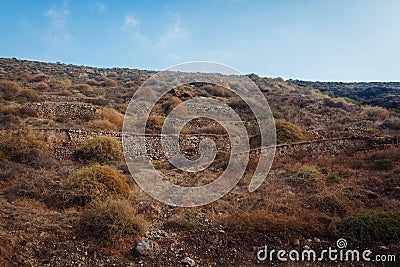 Santorini island autumn hills. Volcano soil natural landscape. Rows of stones Stock Photo