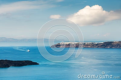 Santorini island, Greece. Blue sea and the blue sky with white clouds Stock Photo