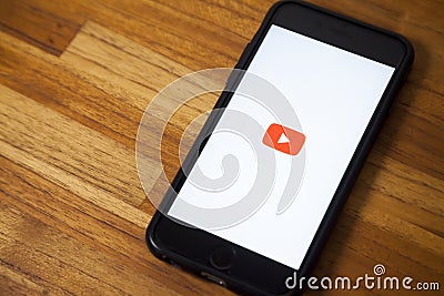 Smartphone with youtube application apen. Editorial Stock Photo