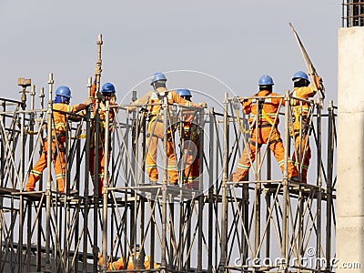 Workers in the construction of the elevated metro track, Line 17 gold Editorial Stock Photo