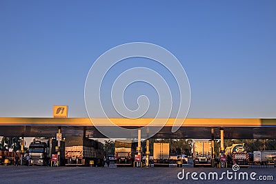 Cargo trucks supply disel oil at a gas station in the Ipiranga network on a highway Editorial Stock Photo