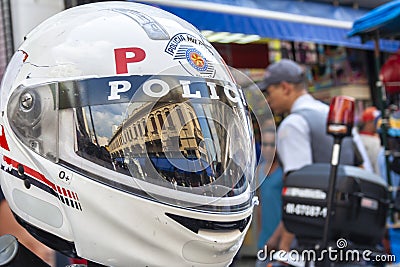 Detail of a Military Police helmet with the reflection of the shops Editorial Stock Photo