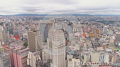SAO PAULO, BRAZIL - MAY 3, 2018: Aerial View of the city centre Banespa building with city flag. Landmark touristic place. Drone shot in 4K stock video SAO PAULO, BRAZIL - MAY 3, 2018: Aerial View of the city centre Banespa building with city flag. Landmark touristic place. Drone shot in 4K stock video