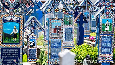 Sapanta, Maramures, Romania - June 17, 2022: Painted blue wooden monuments in an unique in the World Editorial Stock Photo