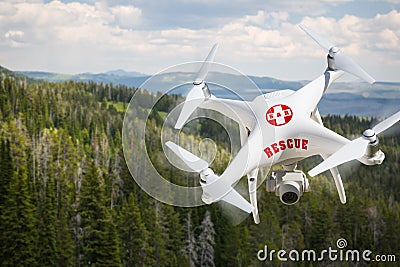 SAR - Search and Rescue Unmanned Aircraft System, UAS Drone Flying Above A Mountain Forest Stock Photo