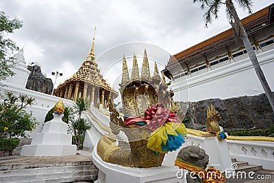 Beautiful golden naka head sculpture on the staircase leading to the main pavilion of Wat Phra Phutthabat Editorial Stock Photo
