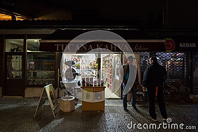 Bosnian coffee packs, near a roaster and a grinder, ready to be sold at night in bascarsija. Editorial Stock Photo