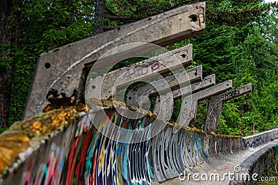 SARAJEVO, BOSNIA AND HERCEGOVINA - AUGUST 28, 2019: Abandoned Olympic Bobsleigh and Luge Track, built for the Olympic Winter Games Editorial Stock Photo