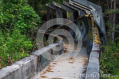 SARAJEVO, BOSNIA AND HERCEGOVINA - AUGUST 28, 2019: Abandoned Olympic Bobsleigh and Luge Track, built for the Olympic Winter Games Editorial Stock Photo