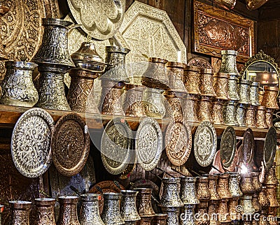 Sarajevo, Bosnia - May 2, 2022 - Copper, silver and brass tableware for sale in shop Editorial Stock Photo