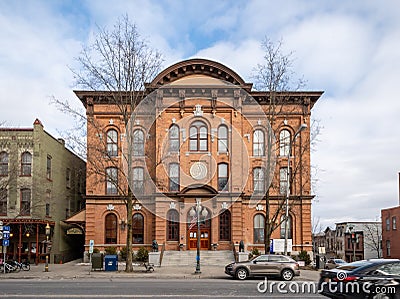 A landscape view of the Saratoga Springs City Hall, an ornate three-story brick Editorial Stock Photo