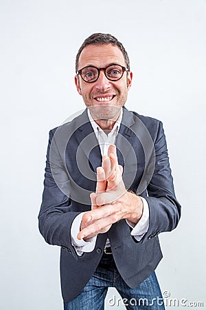 Sarcastic businessman clapping his hands for bullying revenge or success Stock Photo