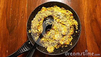 Sardinian fregula, traditional Sardinian pasta, made in a pan with seafood and saffron. Stock Photo