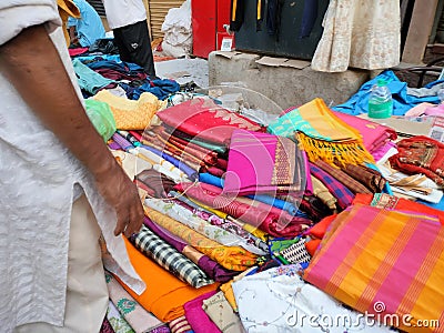 Sarees in beautiful colours like yellow,pink, purple, black, orange for selling Stock Photo