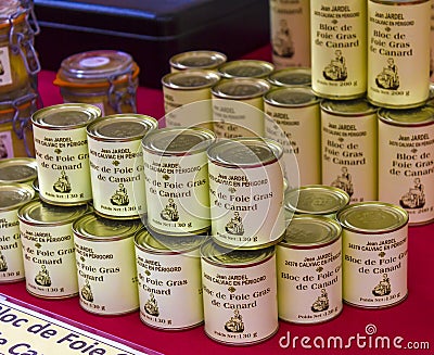 Piles of cans at a shopwindow in Sarlat-la-Caneda. Foie gras is a famous product from Editorial Stock Photo