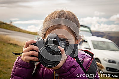 Sarnano - Italy - November 04 2019 - Girl is taking a picture Editorial Stock Photo