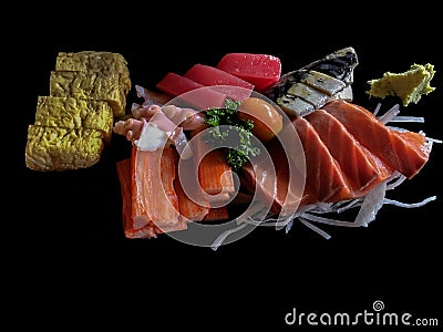 Sashimi Japanese food on black background. Raw fish fillets sal Stock Photo