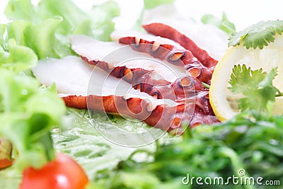 Sashimi octopus, vegetables, lettuce, tomato, octopus Stock Photo