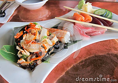 Sashimi, squid salad and vegetables Stock Photo