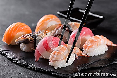 Sashimi sushi with chopsticks Stock Photo