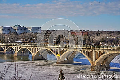 Saskatoon Saskatchewan Canada river bridge winter landscape day cityscape city structural building engineering blue riverside sky Editorial Stock Photo