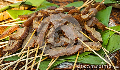 Satay sate skin cow with brown color and banana leaf to serve traditional food Stock Photo