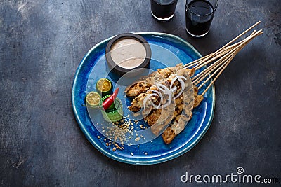 Sate or satay ayam - chicken skewers with peanut sauce, place for wording Stock Photo