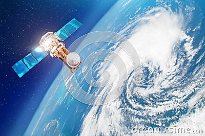 Satellite above the Earth makes measurements of the weather parameters. Research, probing, monitoring of tracking in a tropical st Stock Photo
