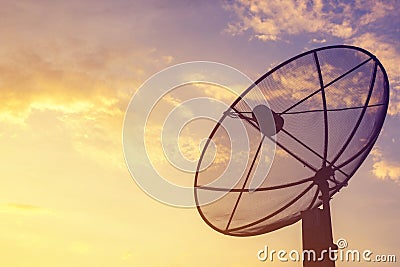 Satellite antenna against with sunset background Stock Photo