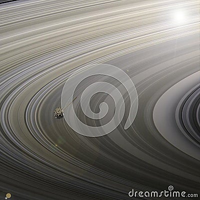 Satellite Cassini is approaching Saturn. Cassini Huygens is an unmanned spacecraft sent to the planet Saturn. Elements Stock Photo