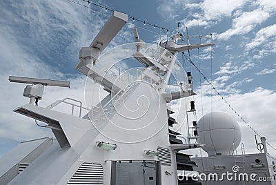 Satellite communication antenna on the top of large passenger ship. Stock Photo