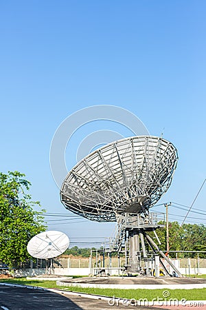 Satellite dish radar antenna station in field. parabolic antennas. Big parabolic antenna against sky. Satellite dish at earth stat Stock Photo