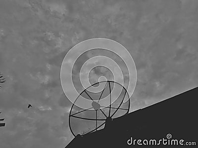 Satellite dish to receive signals on the roof Stock Photo