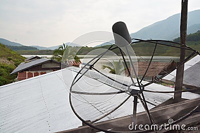 Satellite dish, Telecommunication mast with microwave link and TV transmitter antennas Stock Photo