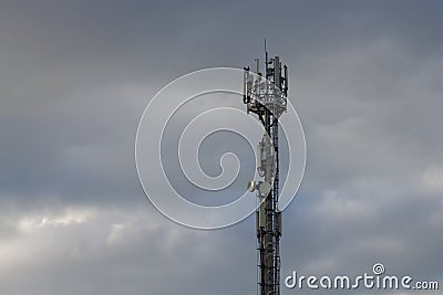 Satellite tower for cellular signal transmission. Sky Stock Photo