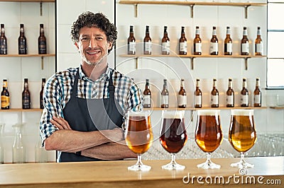 Satisfied bartender behind counter Stock Photo