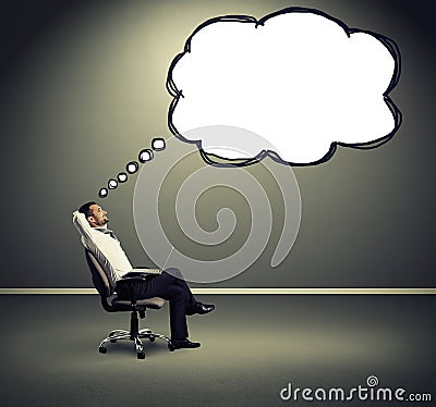 Satisfied businessman with speech balloon Stock Photo