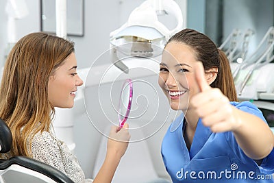Satisfied client and dentist checking results Stock Photo